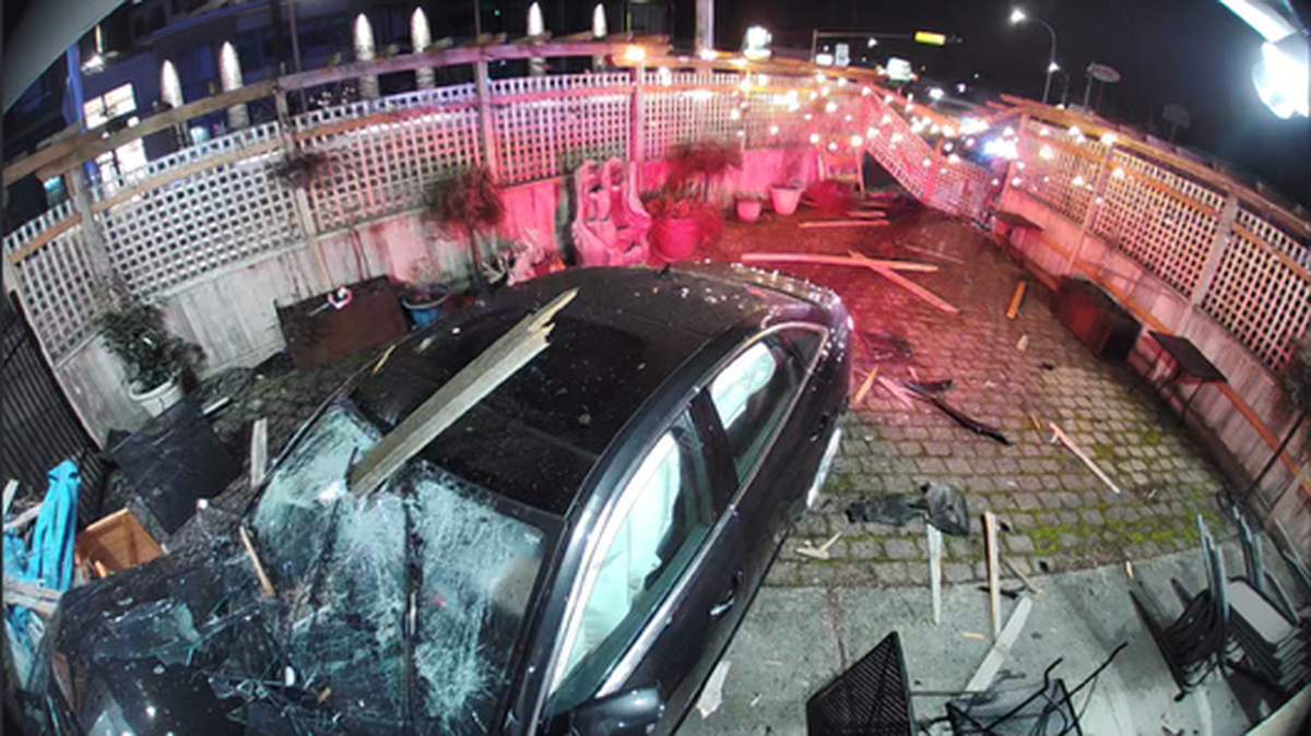 A vehicle drove through the fence and outdoor seating area of Slice of Heaven in Bellingham before colliding with the building itself on Monday, Feb. 19.