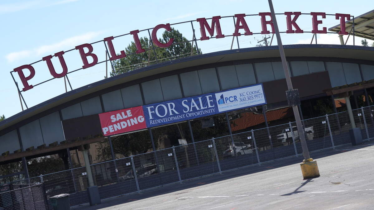 A “Sale Pending” sign is posted on the former Public Market building in Bellingham. The Whatcom Transportation Authority plans to buy the property and turn it into a new transit station.