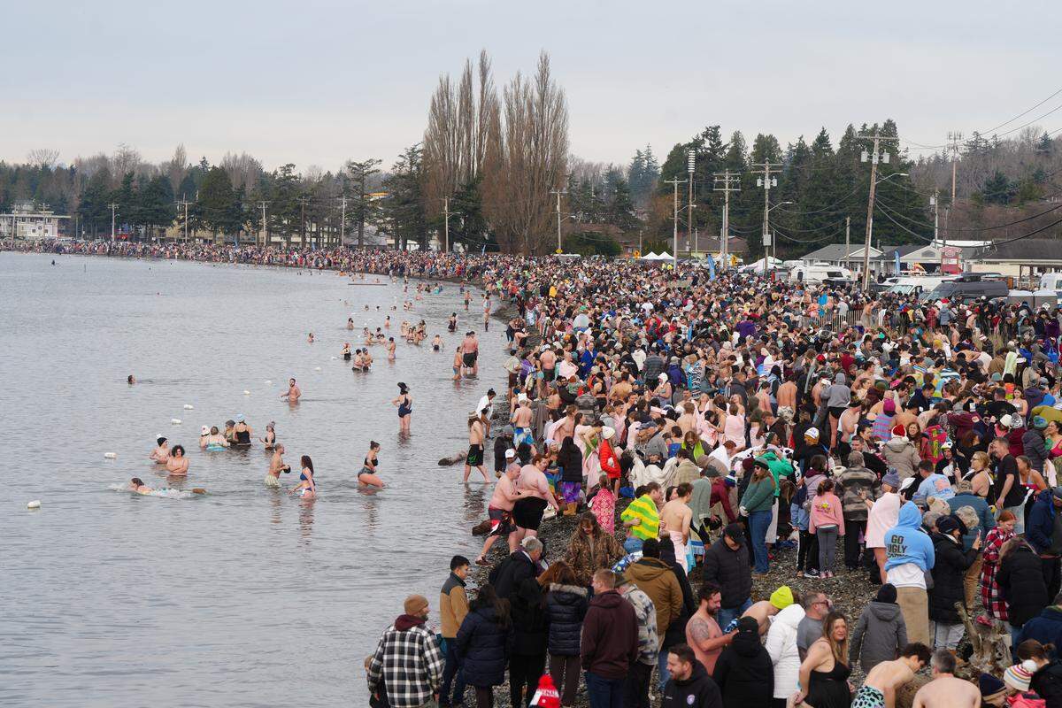 Participants warm themselves after Thursday’s attempt.