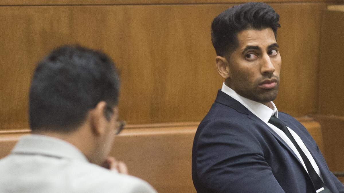 Former Bellingham Police officer Sukhdev Dhaliwal, right, and his brother Jagmeet Dhaliwal appear in Whatcom County Superior Court on the first day of their assault trial on Sept. 10 in Bellingham.
