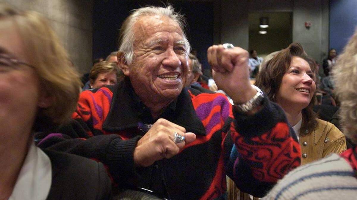 Tribal activist Billy Frank Jr. of the Nisqually tribe, pumps his fist in 2004 as the Washington State Historical Court overturned the murder conviction of Chief Leschi, a Nisqually leader who was hanged in 1858 for the killing a United States soldier.