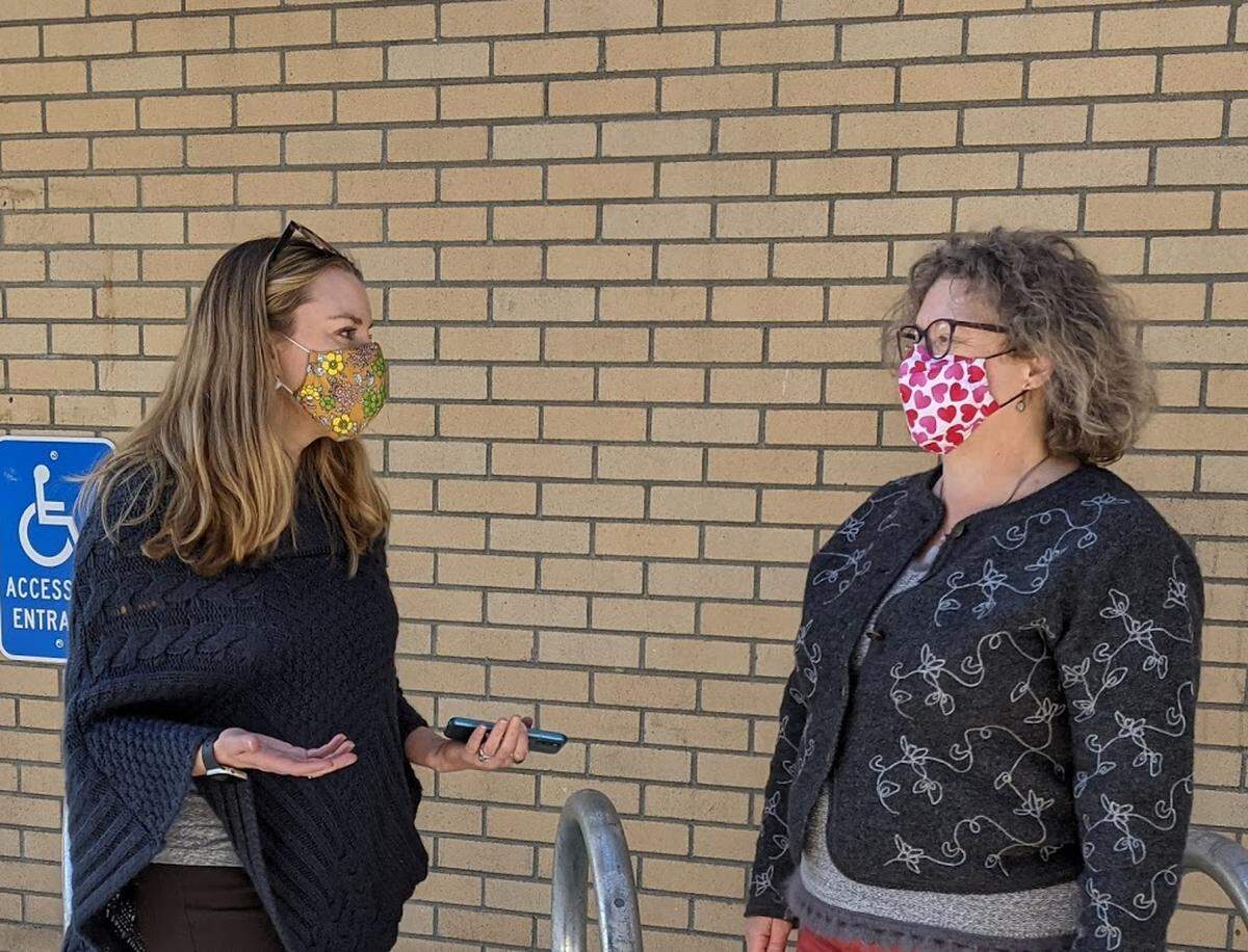 Whatcom County Health Department Director Erika Lautenbach, left, speaks to Communicable Disease and Epidemiology Manager Cindy Hollinsworth.