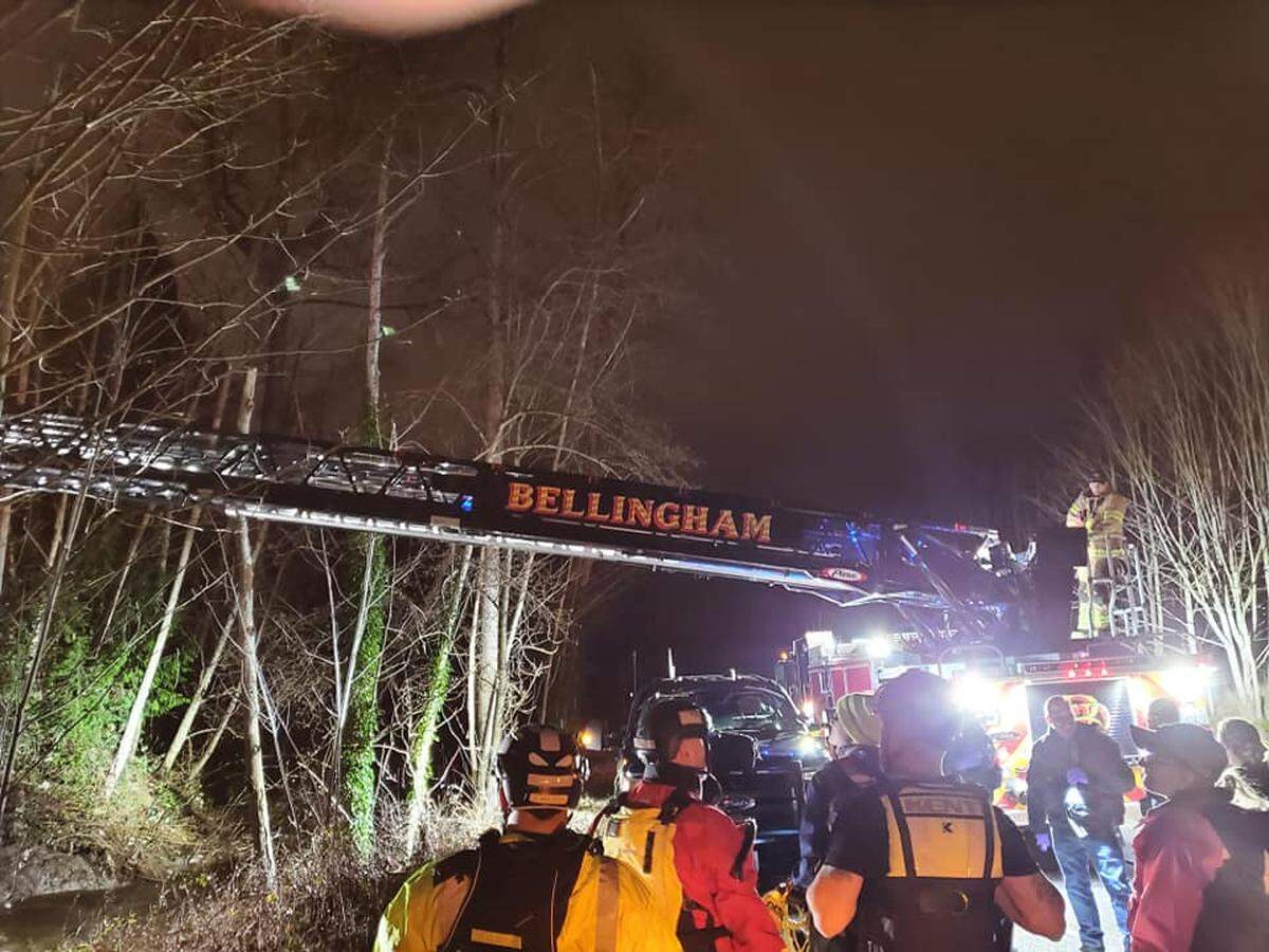 Rescue crews work to recover a man’s body from Squalicum Creek in Bellingham Tuesday evening, Dec. 14.