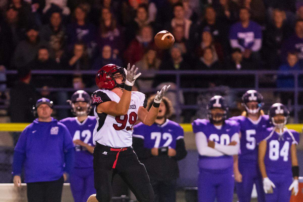 Mount Baker tight end Alex Maloley (99) catches a long pass from quarterback Davin Beason (19) for a first down during the second quarter on Oct. 8, 2021, at Nooksack Valley High School in Everson. Mount Baker defeated Nooksack Valley 40 to 34. This year, Beason is bidding for playing time at linebacker for Portland State.