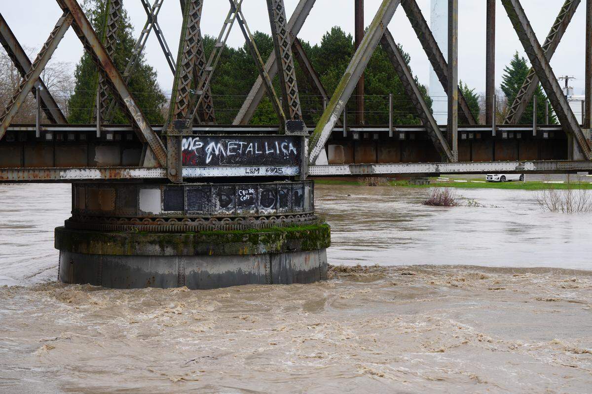 The Nooksack River was flowing fast and high on December 10, 2025, through Ferndale, Wash., as the city issued a voluntary evacuation order amid rising waters and flooding.