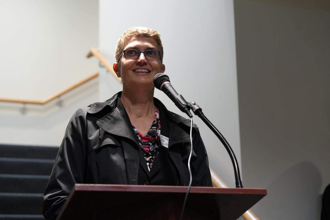 Unity Care NW CEO Jodi Joyce speaks at the ribbon-cutting ceremony for The Way Station respite and hygiene services center in 2024.