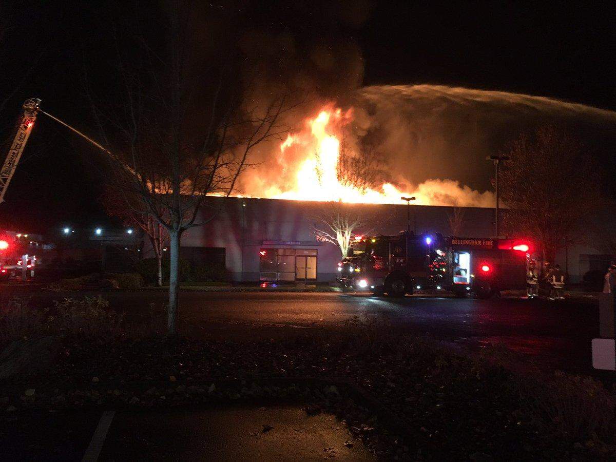 Firefighters pour large streams of water on the fire at Blue Sea Systems early Nov. 10.