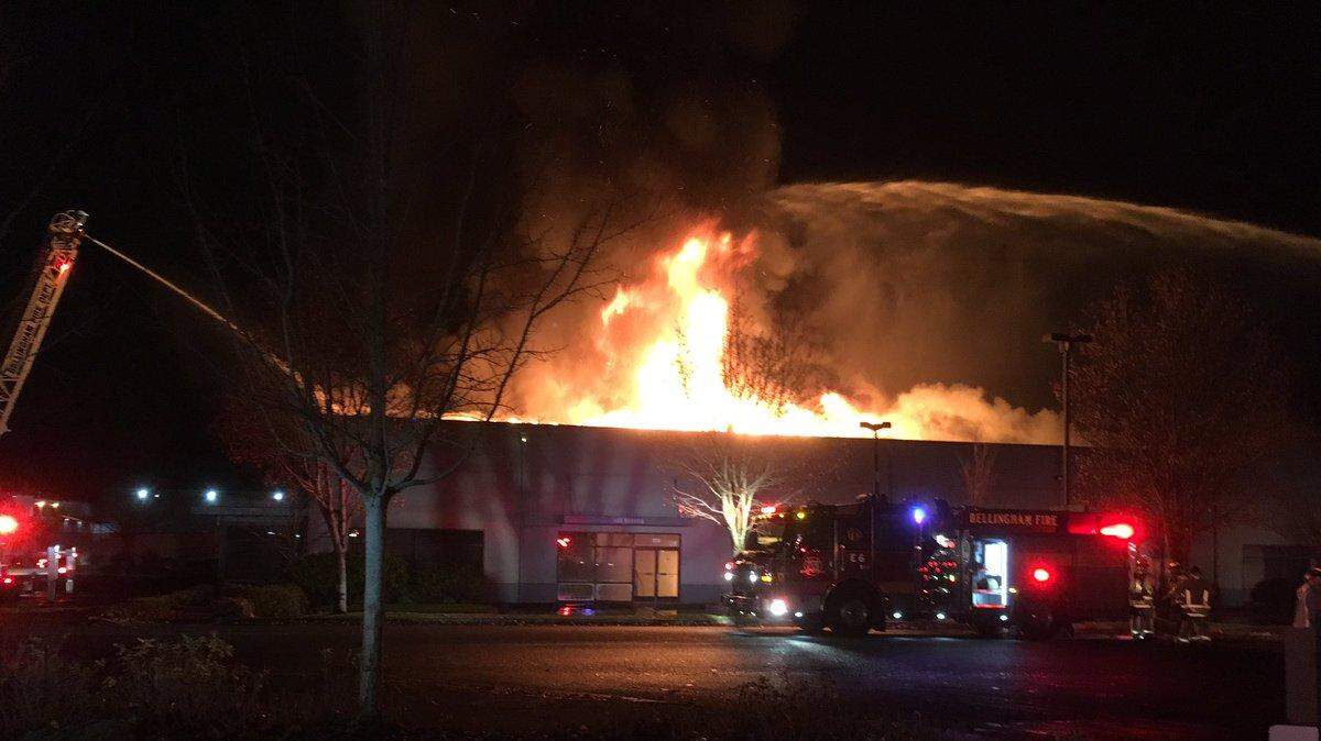Firefighters pour large streams of water on the fire at Blue Sea Systems early Nov. 10.