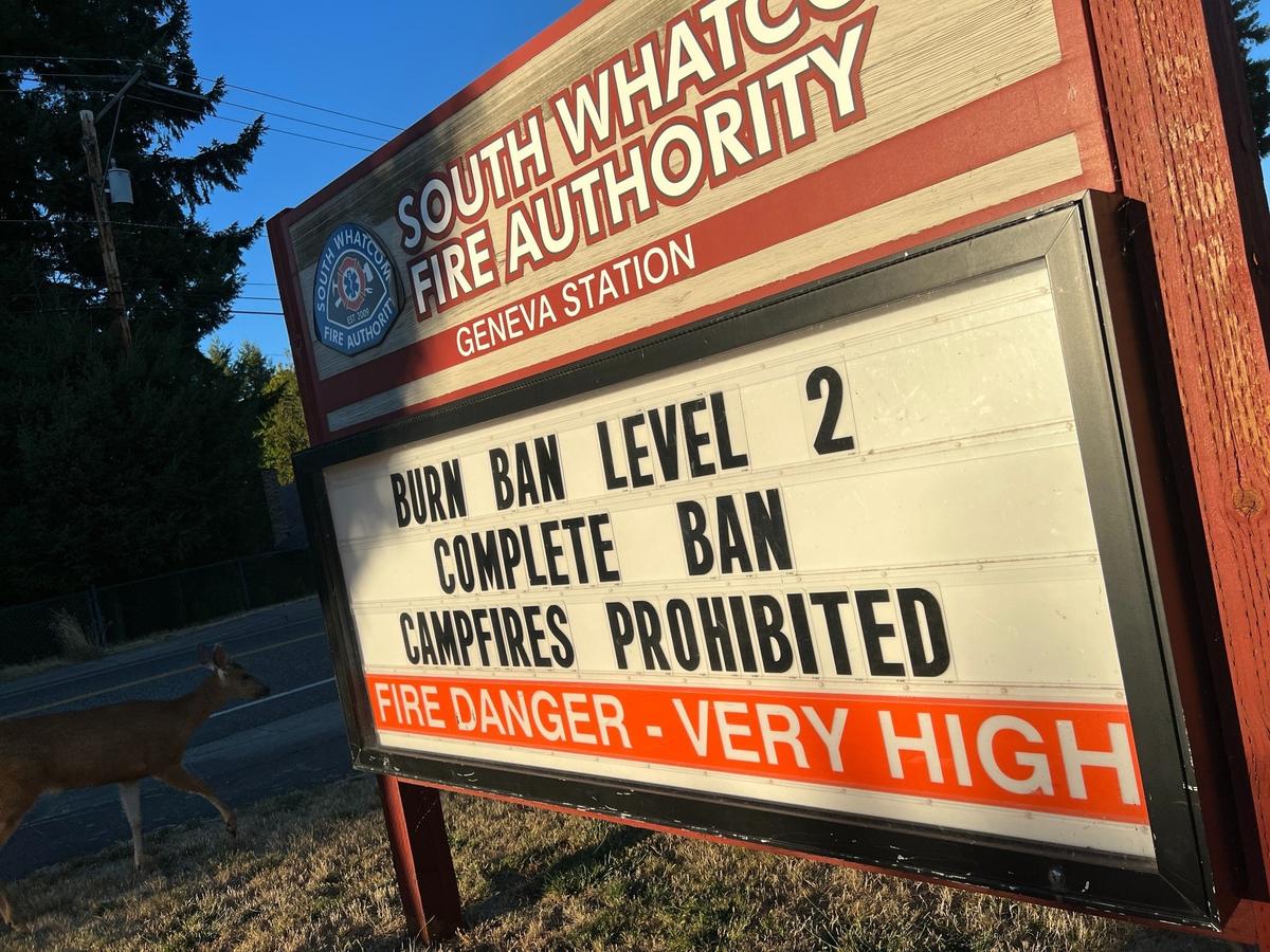 A sign outside South Whatcom Fire Authority Station 21 in the Geneva neighborhood east of Bellingham, announces a countywide burn ban Wednesday.