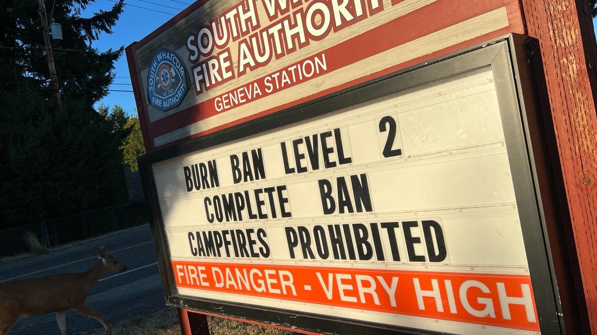 A sign outside South Whatcom Fire Authority Station 21 in the Geneva neighborhood east of Bellingham, Wash., announces a countywide burn ban Wednesday, Aug. 16, 2023.
