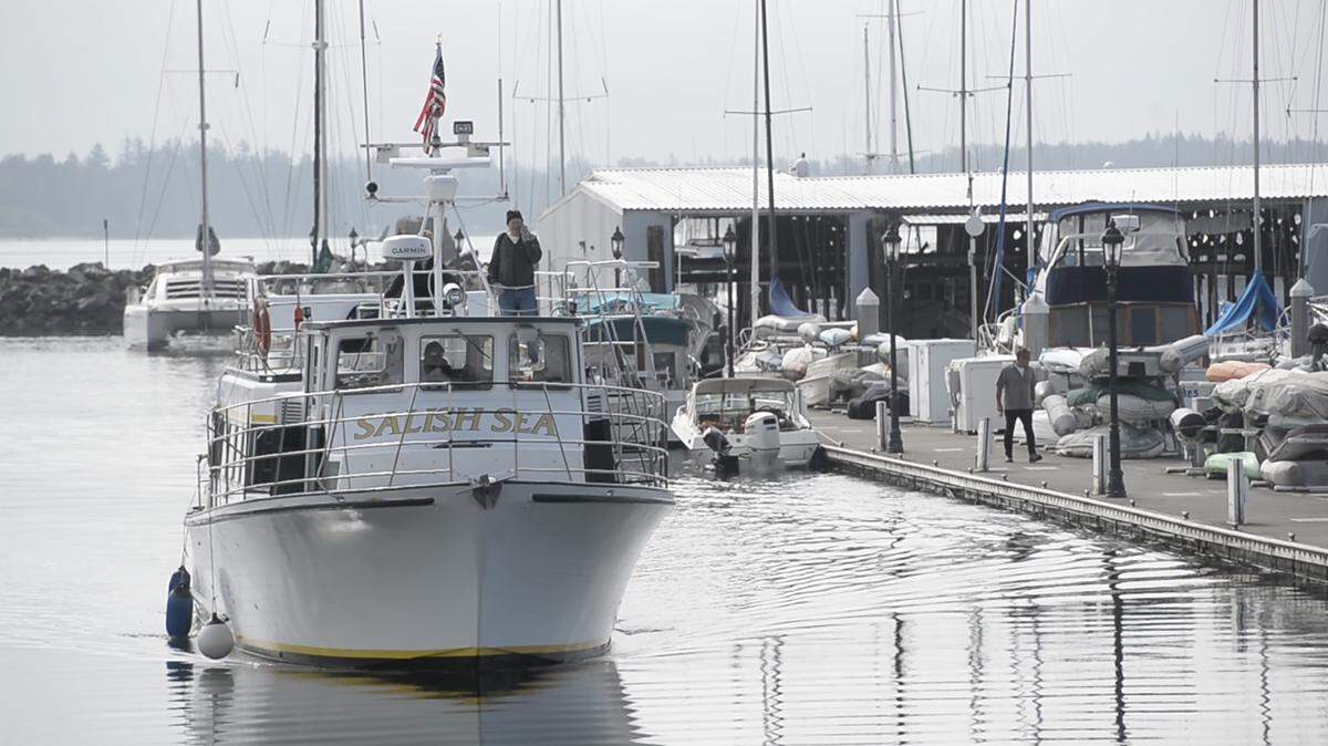 A ferry of Point Roberts residents arrives in Blaine, Wash., on Tuesday, Aug. 25, 2020. Demand for the new ferry service is much stronger than expected while non-essential travel across the U.S.-Canada border is limited due to the COVID-19 pandemic, so the Port of Bellingham is making several changes.