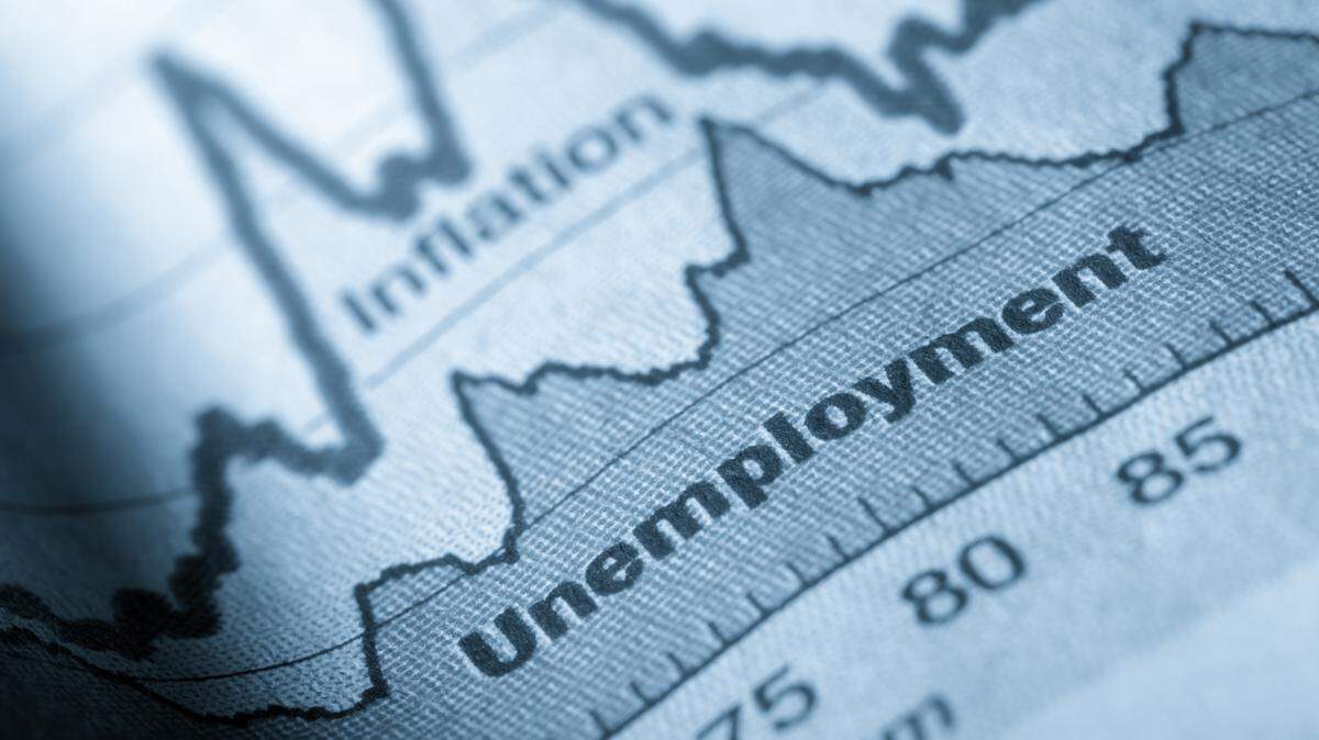 Business graph unemployment and inflation in newspapers