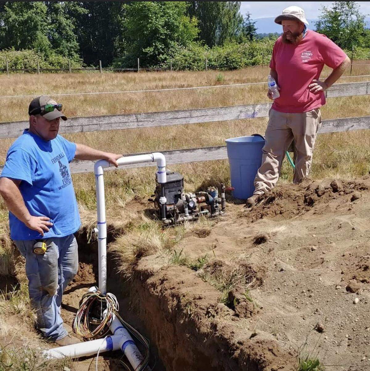 Volunteer Greg Gandy leads the installation of a new irrigation system at the Chuckanut Bay Rugby facility in Ferndale in spring 2020 along with club member Joel Weisser.