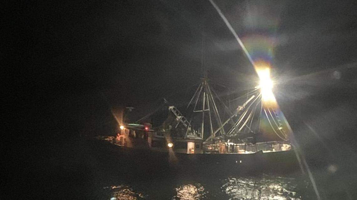 The U.S. Coast guard says a shark attacked a crew member when the man fell from a vessel while untangling fishing nets off Grand Isle, Louisiana.