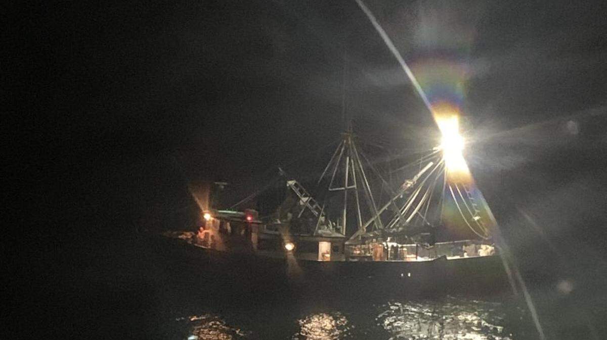 The U.S. Coast guard says a shark attacked a crew member when the man fell from a vessel while untangling fishing nets off Grand Isle, Louisiana.