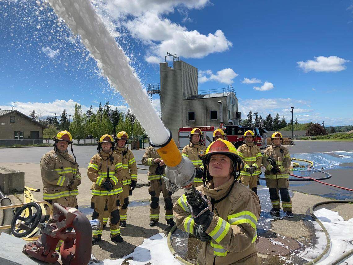 Bellingham Fire Department recruit Carlee Bock works with a hose using firefighting foam during a training session in mid-May, according to a post on the department’s Facebook page.