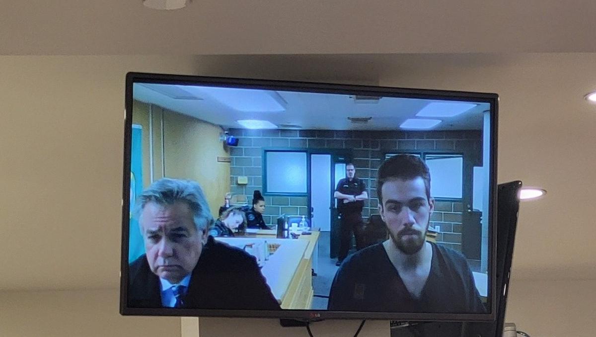 Elijah James Belmont, 22, of Marysville, Wash., right, makes his first appearance in Whatcom County Superior Court on Thursday, Dec. 7, 2023.