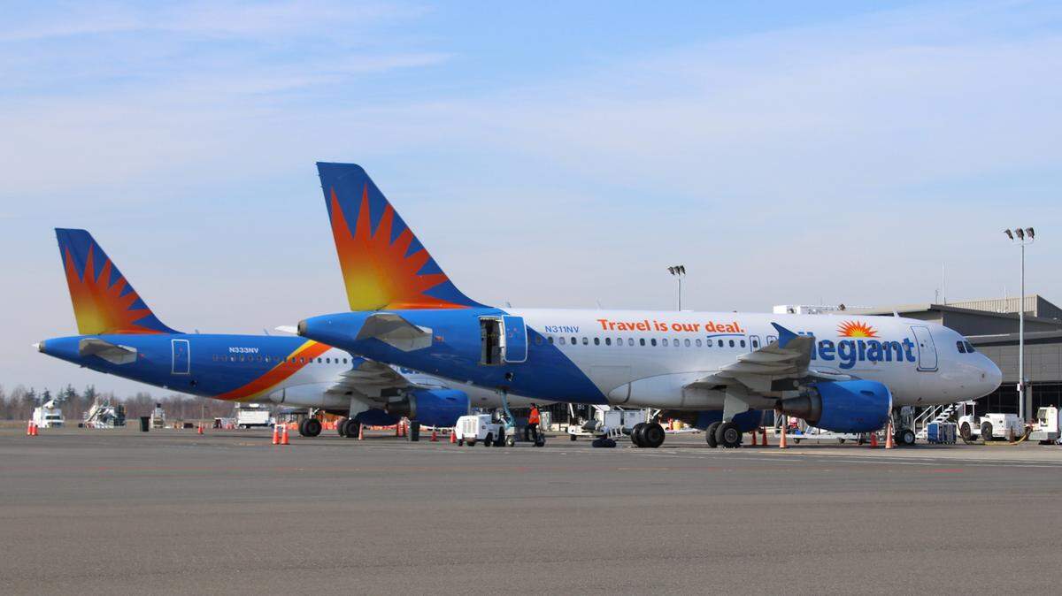 Two Allegiant Airbus 319 airliners sit on the ramp at Bellingham International Airport Thursday, March 19, 2020.