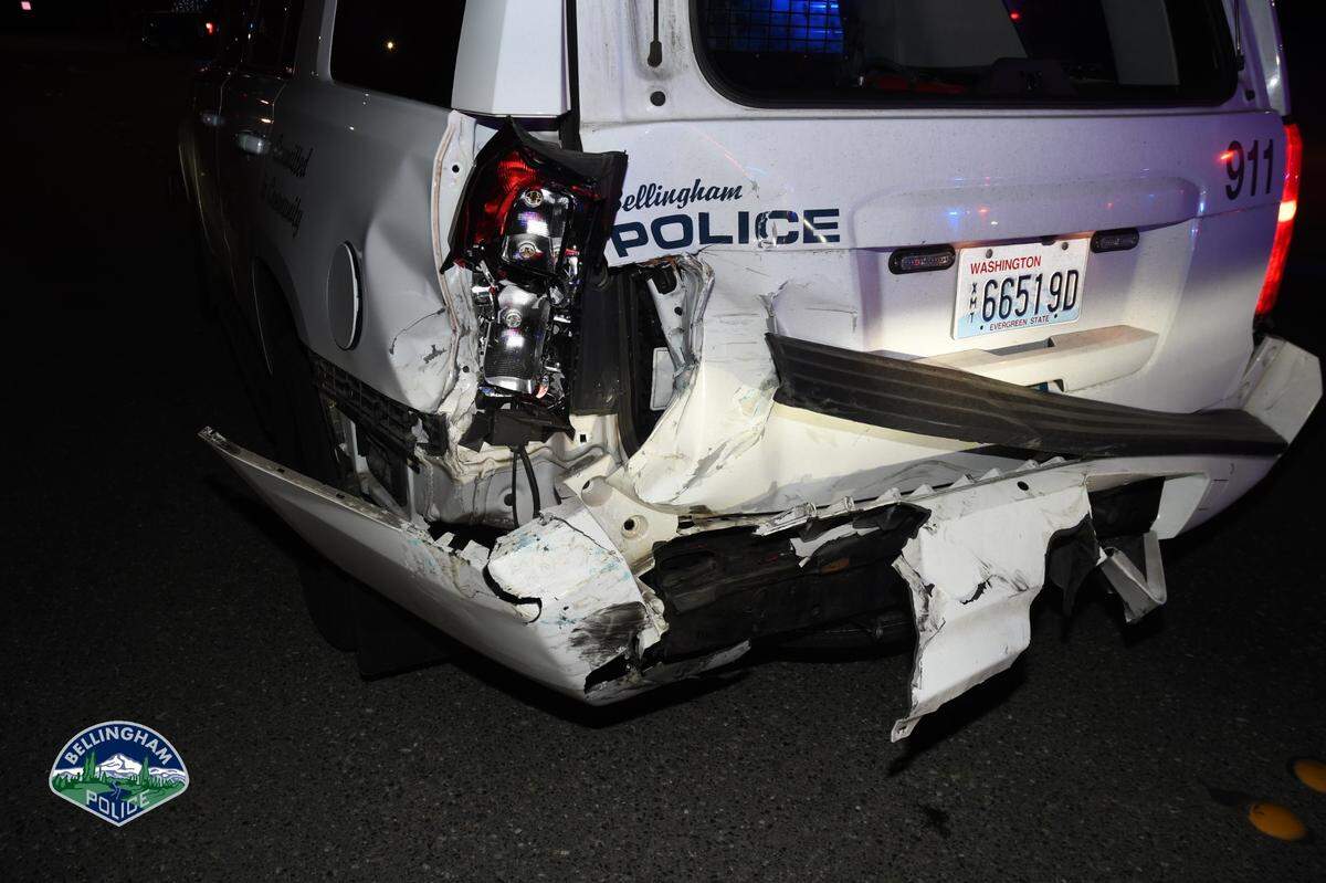 Bellingham Police are searching for the driver of a stolen truck that ran a red light, slammed into a patrol vehicle and narrowly missed two pedestrians in a cross walk along Meridian Street and left the scene Thursday night, March 3.