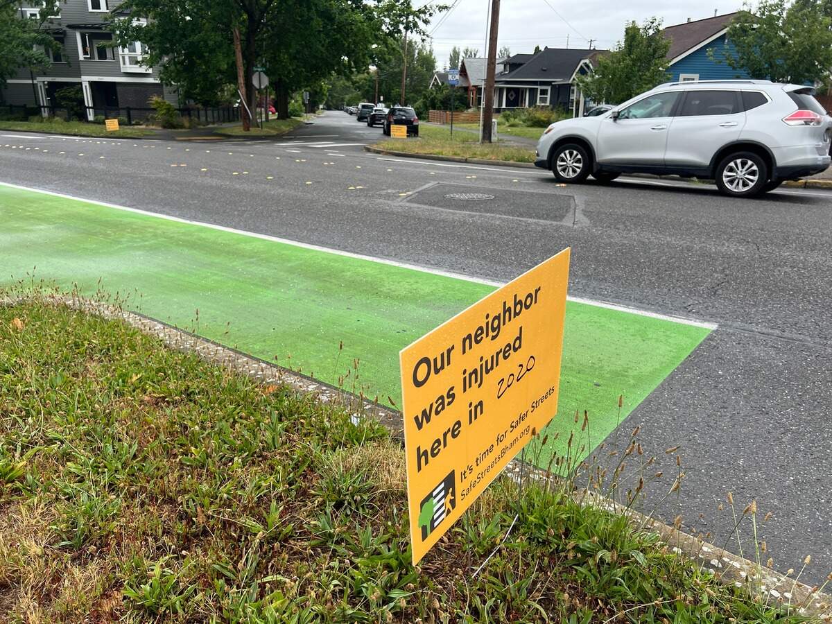 A car passes a Safe Streets sign on Cornwall Avenue just north of Bellingham High in Bellingham Wash., on Thursday, July 2, 2023.