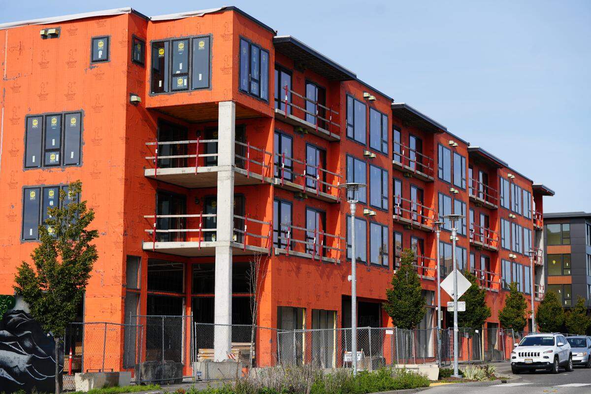 The second of three multi-million dollar residential condo buildings is seen under construction along the waterfront on October 3, 2024, in Bellingham, Wash. The first building was nearing completion while the entire three-building project was years behind schedule.