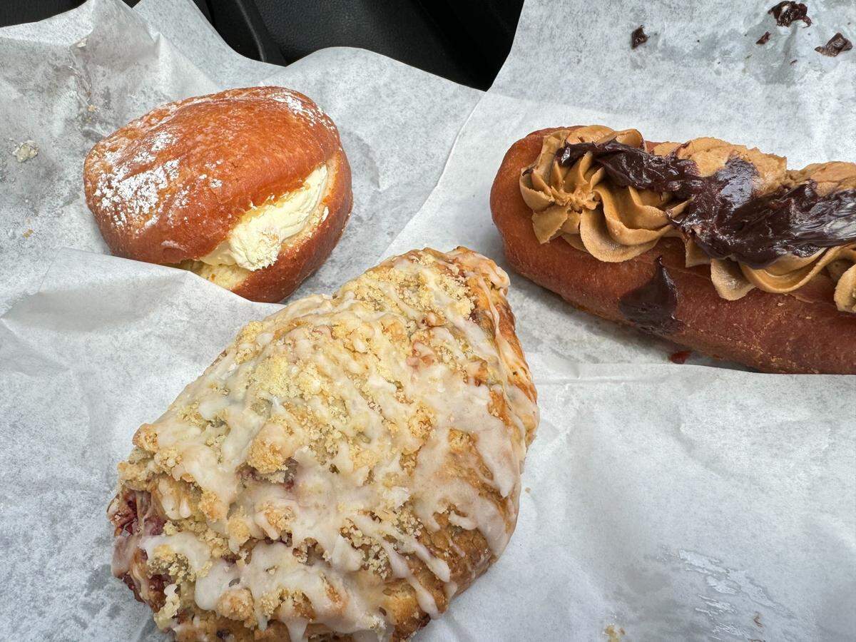 A raspberry scone, cream filled donut and maple chocolate bar donut from Barb’s Pies and Pastries on Wednesday, June 26 at 2054 Main St. in Ferndale, Wash.