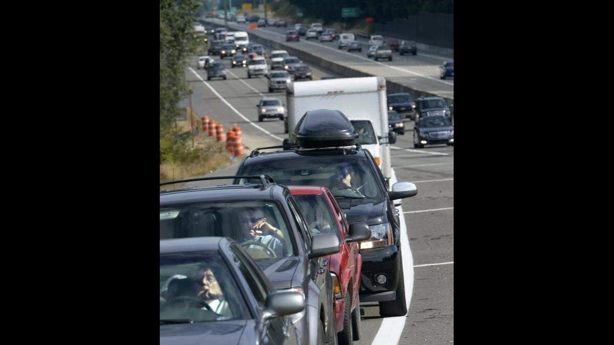 Scan the road ahead and make sure to get into your exit lane in plenty of time to avoid having to merge at the last possible moment when gaps in traffic are smaller.