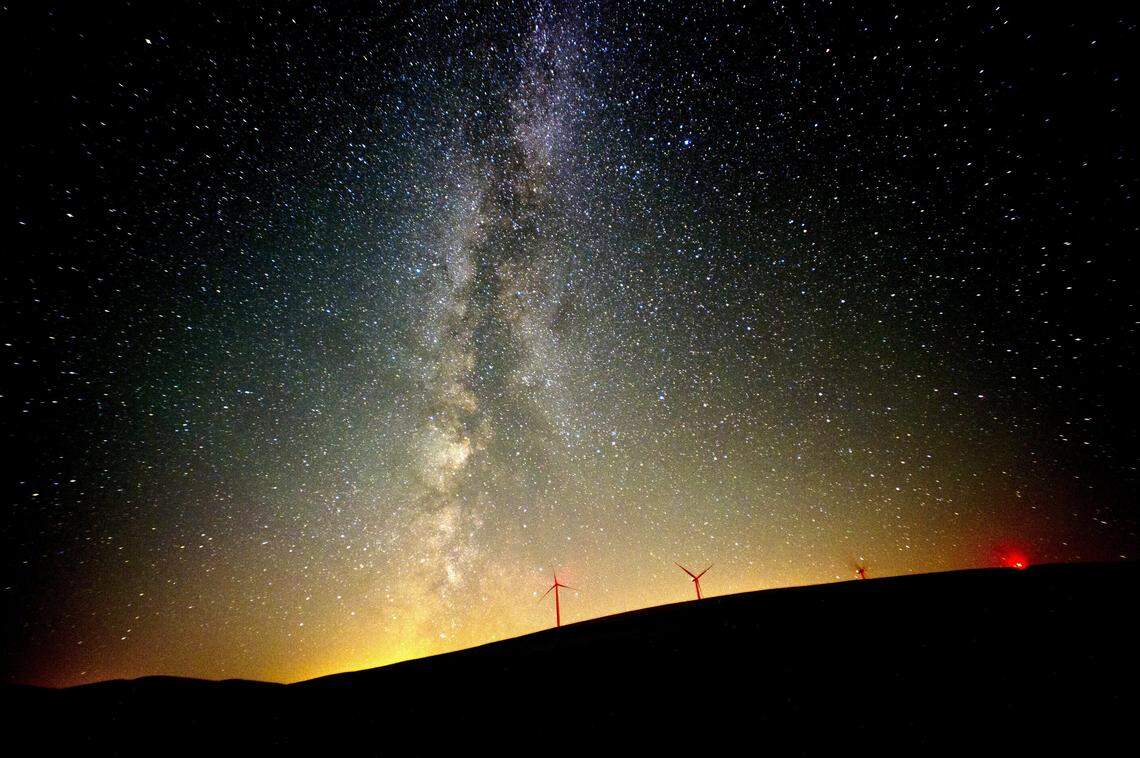 The Milky Way lights up the sky in August 2016 near wind mills north of Dayton. Millions of homes, buildings and landmarks will go dark for at 8:30 p.m. local time Saturday as part of the annual Earth Hour.