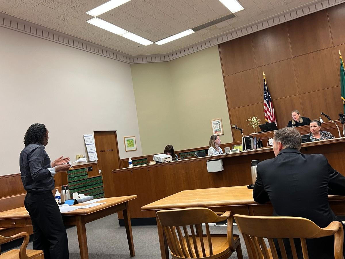 Joel Johnson, left, argues his case in Whatcom County Superior Court on Tuesday, June 6, 2023, in Bellingham, Wash. Deputy civil prosecutor Royce Buckingham is at right and Judge Lee Grochmal is on the bench.