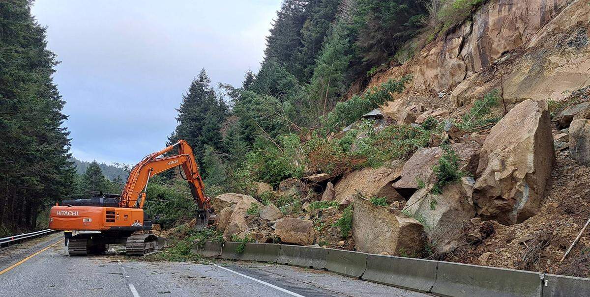 State workers clear debris along northbound Interstate 5 following a landslide March 19 near milepost 246.