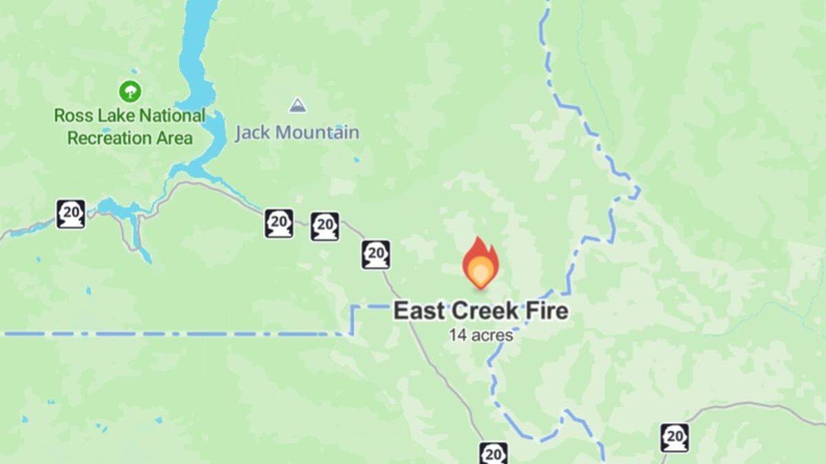 A screenshot from the Watch Duty app shows the size and location of the East Creek Fire in southeast Whatcom County.