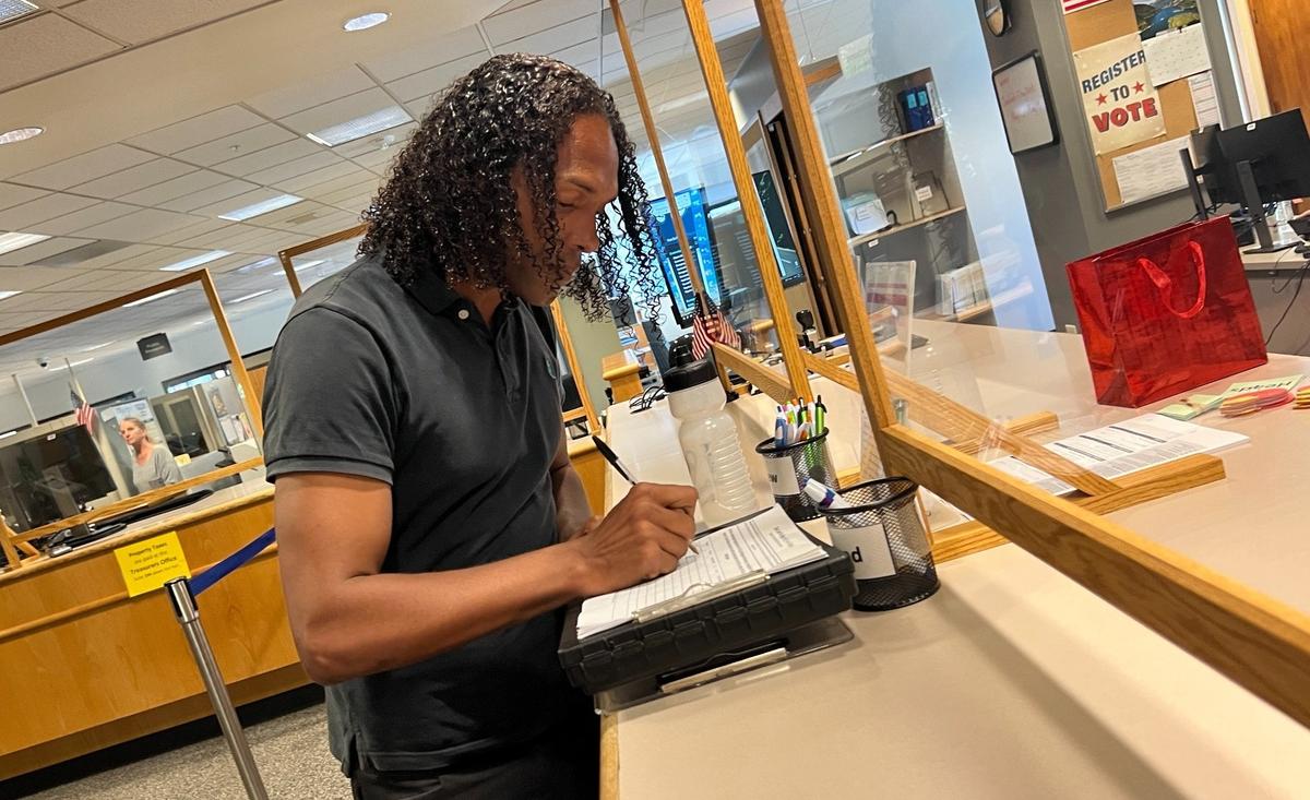 Joel Johnson files his petitions to run for Bellingham Mayor on May 19 at the Whatcom County Courthouse.