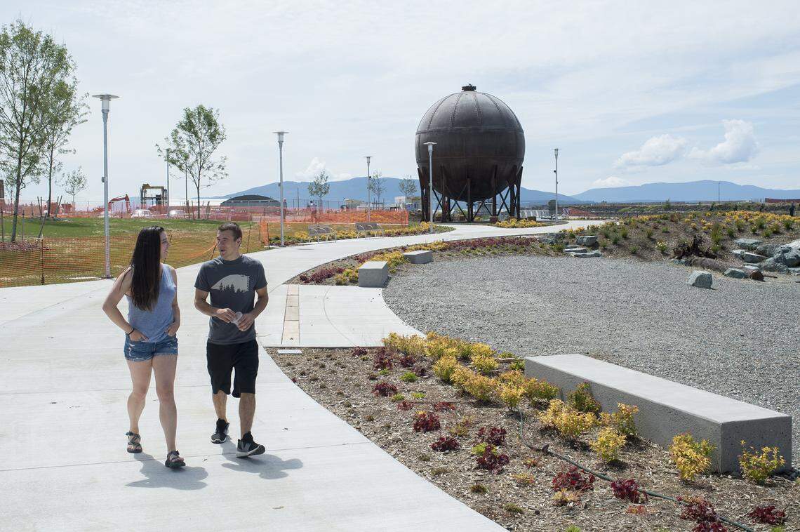 Emily Koch, left, and Tim Lankhaar walk together at Waypoint Park in Bellingham.