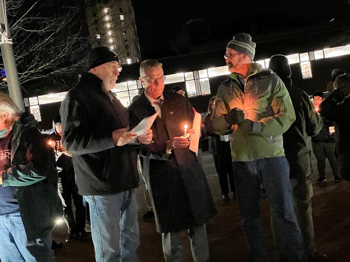 Opportunity Council volunteer Rob Vollkommer, left, Bellingham Mayor Seth Fleetwood and City Council President Michael Lilliquist attend a memorial organized by the Opportunity Council honoring the deaths in 2022 of 64 people who were homeless in Whatcom County.