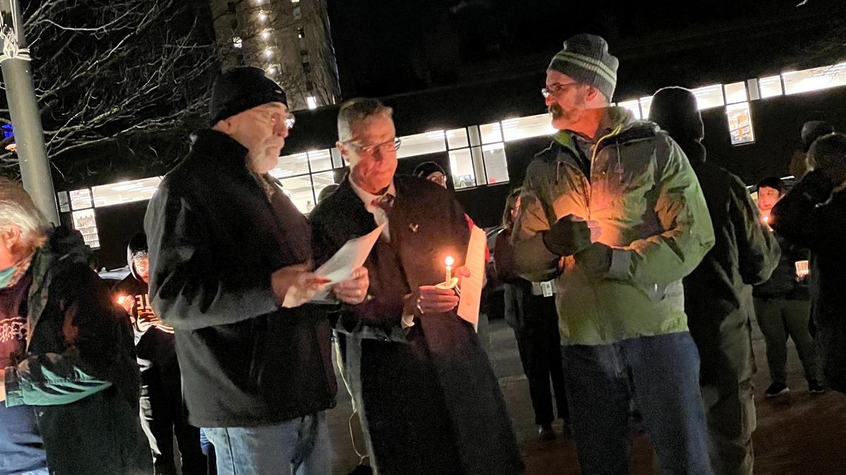 Opportunity Council volunteer Rob Vollkommer, left, Bellingham Mayor Seth Fleetwood and City Council President Michael Lilliquist attend a Jan. 4 memorial organized by the Opportunity Council honoring the deaths in 2022 of 64 people who were homeless in Whatcom County