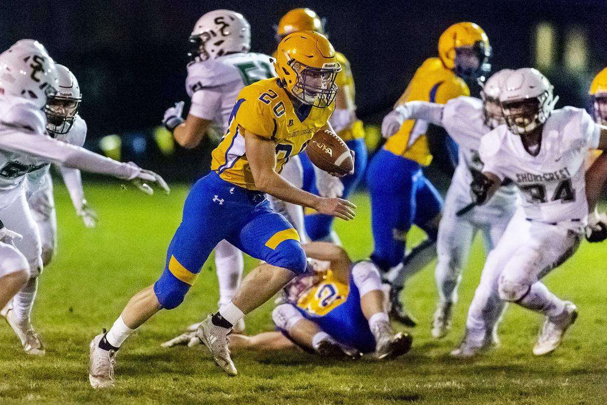Ferndale running back Jacob Broselle (20) breaks through the line of scrimmage and dashes for a 78-yard touchdown during the first quarter against Shorecrest against Friday evening Nov. 1, 2019, at Ferndale High School in Ferndale, Wash.