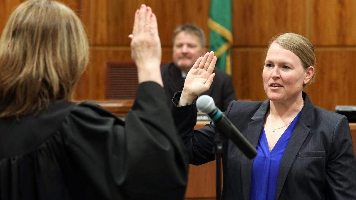 Police Chief Rebecca Mertzig is sworn in Thursday, June 2,by Bellingham Municipal Court Judge Debra Lev in Bellingham.