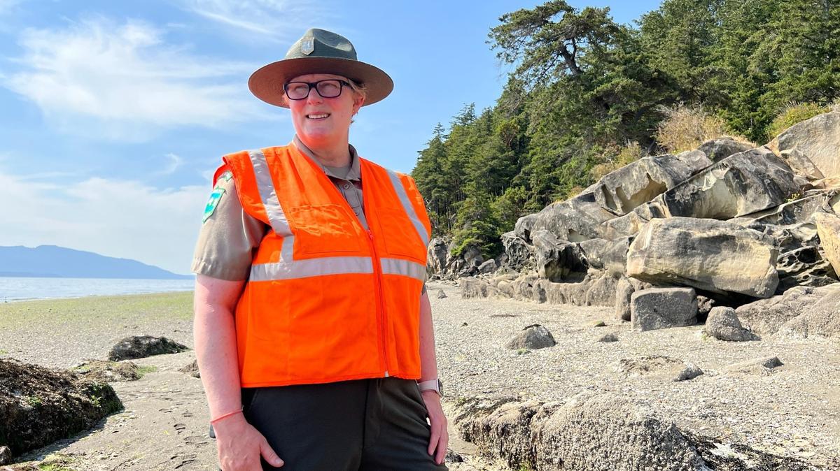 Ranger Amber Forest, who manages Larrabee, Birch Bay and Peace Arch state parks in Whatcom County, stands on the shoreline at Clayton Beach on July 6.