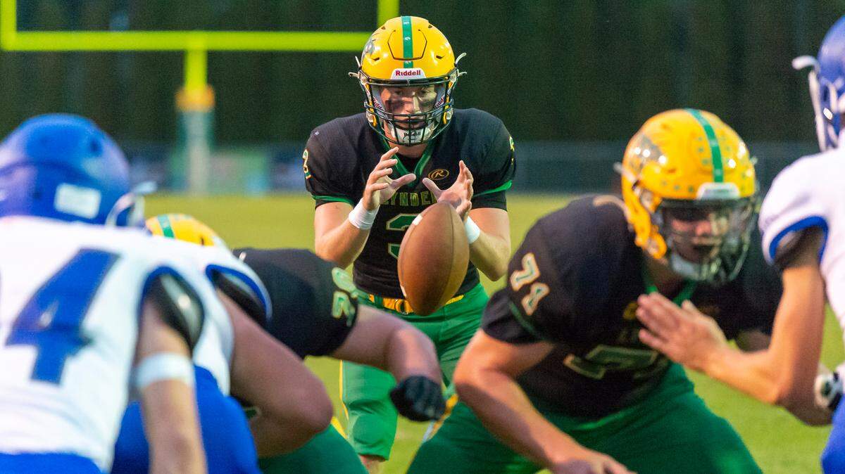 Lynden quarterback Kaedan Hermanutz (3) receives a snap from center on Friday evening, Sept. 23, at Lynden High School. The No. 1 seed Lynden heads into Class 2A state playoffs facing No. 8 Highline at 6 p.m. Friday at Civic Stadium.