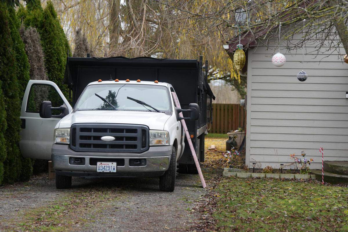 Foam insulation is propped against a work truck outside of home on December 11, 2025, in Ferndale, Wash. Homeowner Joe Sumrall planned to use the insulation to block the vents around the house to mitigate flooding impacts.