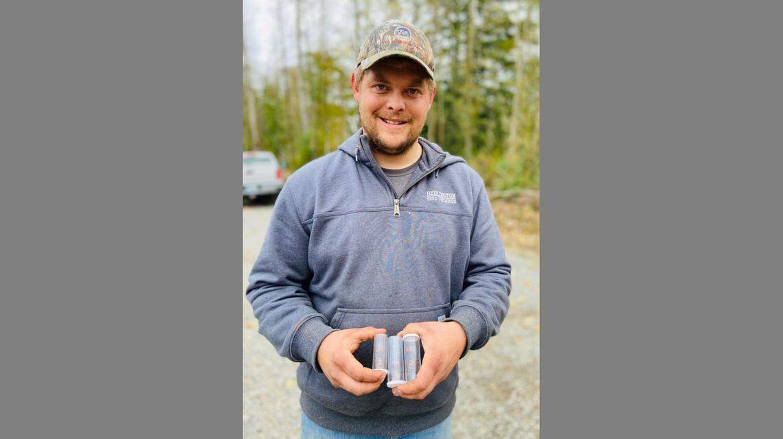 Jaime Polinder holds three Asian giant hornets from a nest found in the cavity of a tree on his property off Burk Road, southeast of Blaine. The invasive hornets were discovered on Wednesday, Oct. 28, after the tree was cut down. The nest is the first so-called “murder hornet” nest found in Washington state and the U.S., and state entomologists are trapping and tracking the hornets in order to find and destroy their nests so they don’t become established in the Pacific Northwest.