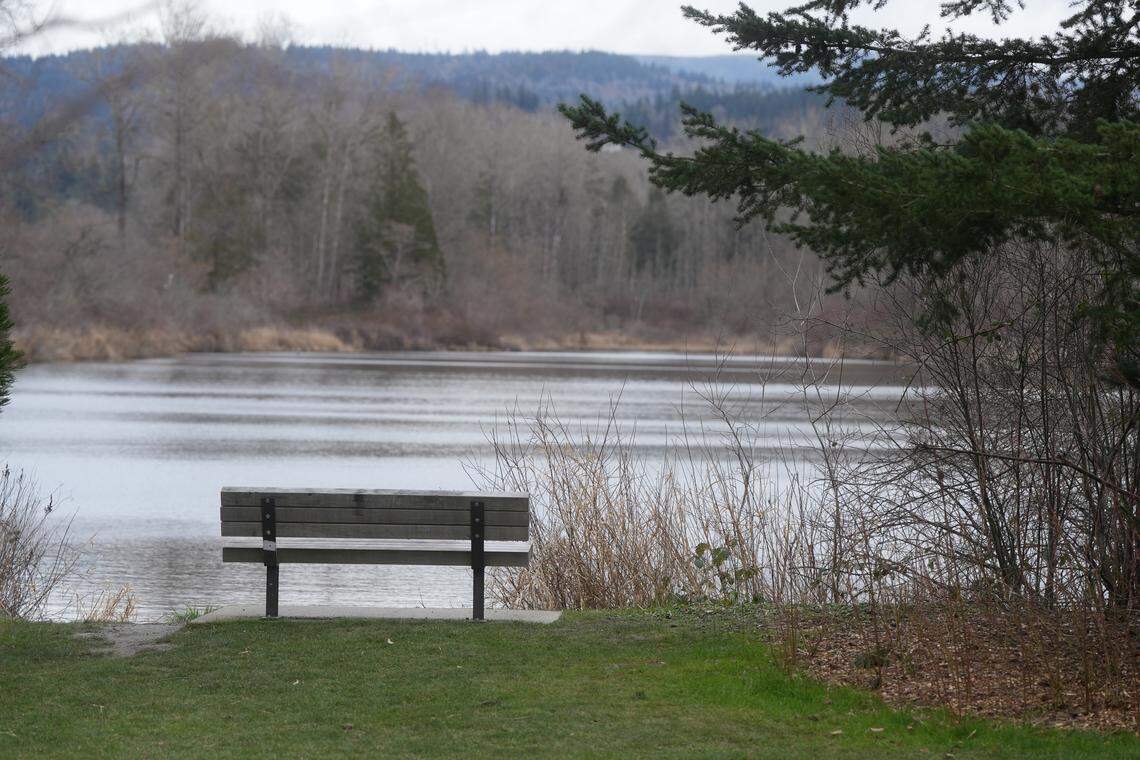 A bench for visitors to enjoy the view sits on the edge of Sunset Pond.