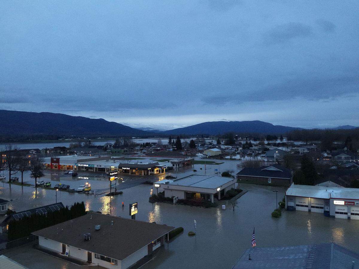 An aerial photo shows widespread flooding impacting homes and businesses after the Nooksack River overtopped its banks on December 11, 2025, in Everson, Wash.