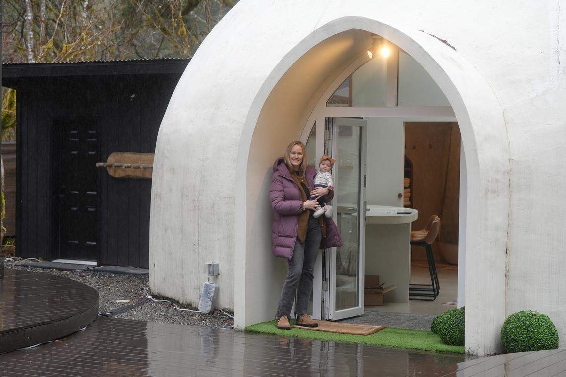 Anna Van Ry, the owner of the Skyview Dome, stands outside of the Airbnb with her daughter on March 11, 2026, in Glacier, Wash.