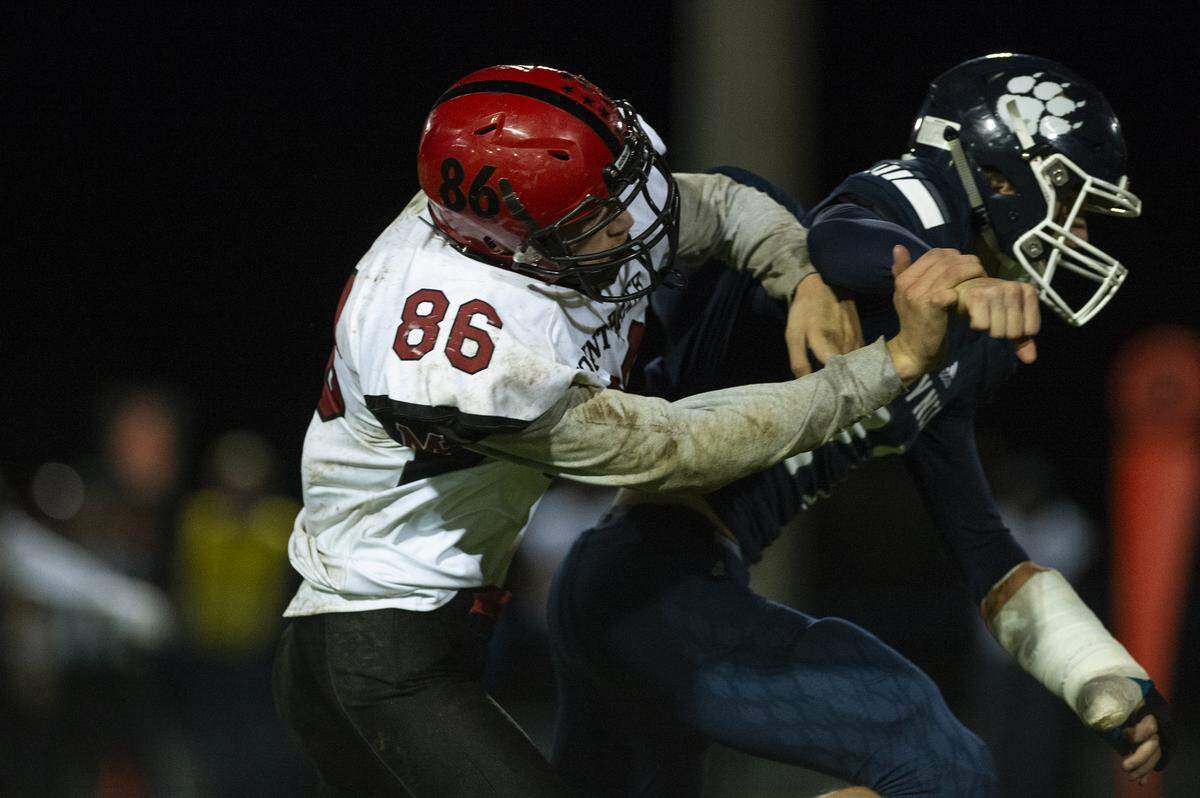 Mount Baker senior Waylon Kentner tackles a Lynden Christian player during the second half of the Mountaineers’ 24-8 win over the Lyncs at Lynden Christian High School in Lynden, Wash., Friday, Sept. 27, 2019.