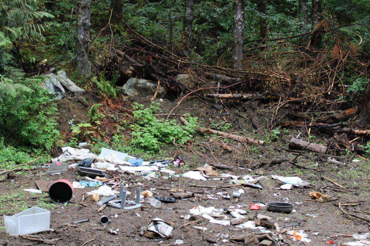Trash is scattered on Sumas Mountain in Deming Thursday, Aug. 4. Illegal dumping, shooting and trail building has caused the Washington State Department of Natural Resources to close the historic recreation area to motor vehicles until Sept. 1.