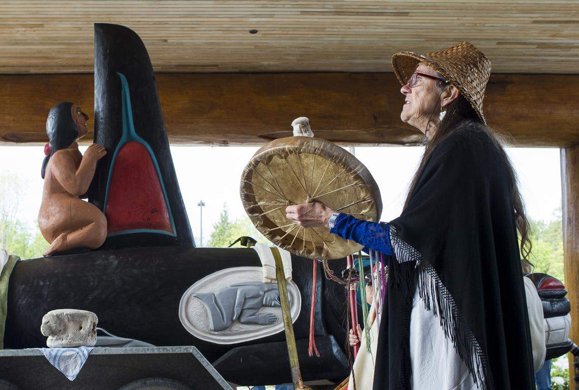 Seattle resident Lorraine Bayes performs a song she wrote called "The Grandmother Song" during the Lummi Nation stop of the Tokitae Totem Pole Journey 2018 on Thursday, May 10, at the Lummi Nation Tribal Administration Center north of Bellingham. The orca totem pole, and two accompanying seal poles, were carved by Jewell James and the House of Tears carvers and are being trucked to Miami in an effort to free Tokitae, a killer whale.  Known as Lolita at the Miami Seaquarium where she has lived for more than 47 years, she is the last survivor of the more than 50 orcas captured off Puget Sound on Aug. 8, 1970.