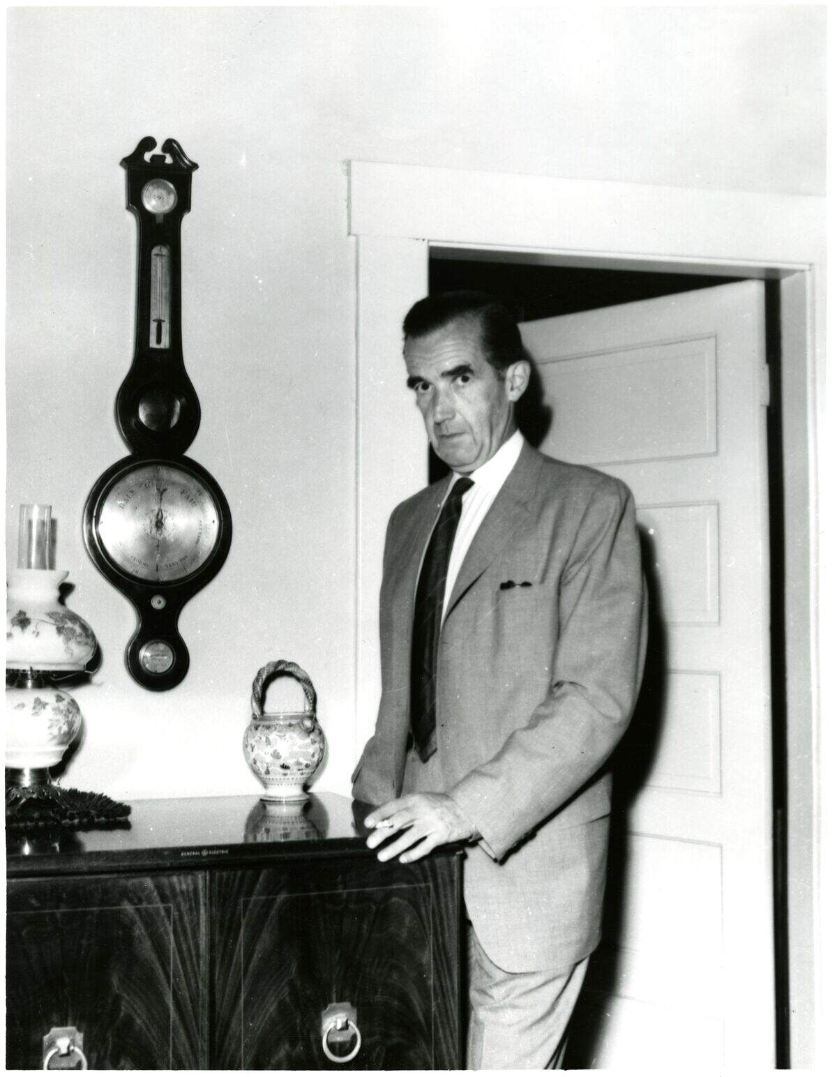 In an undated black and white photograph believed to have been taken some time between 1960 and 1970, Edward R. Murrow stands in his mother’s house at 903 13th Street in Bellingham, Wash.