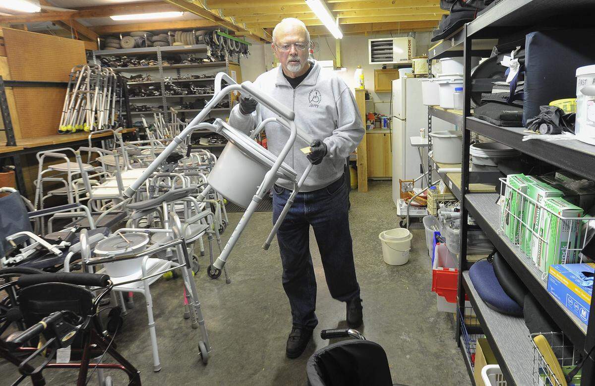 Manager Jerry McLean helps customers at the Al Boe Lions Wheelchair Warehouse in Bellingham in 2015. The warehouse is open Mondays and Thursdays 9 a.m. to 11:30 a.m., and loans out free wheelchairs, walkers and other equipment to those in need.