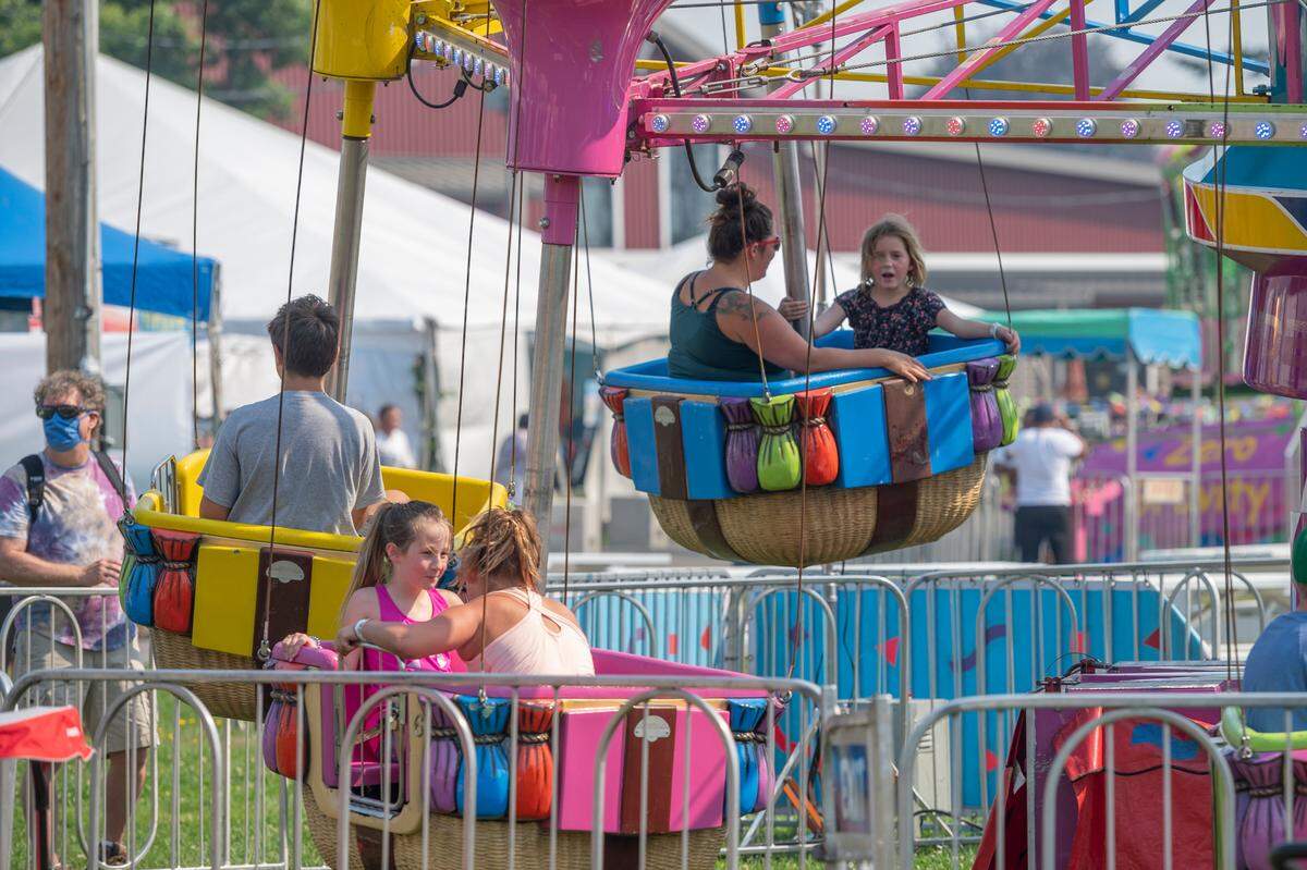 People ride carnival rides, open 11 a.m. to 10 p.m. during the Northwest Washington Fair, which is open Thursday, Aug. 12, to Saturday, Aug. 21, in Lynden.